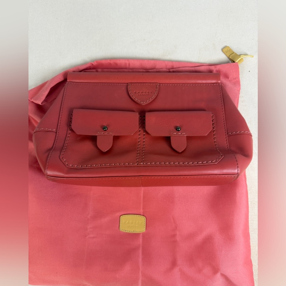 Radley London leather clutch bag in coral